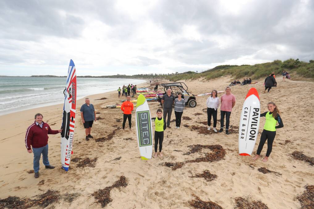 NEW RIDES: Clive Chislett, the Watson and Titmus families, athletes and committee members with the Warrnambool Surf Lifesaving Club's new equipment. Picture: Morgan Hancock
