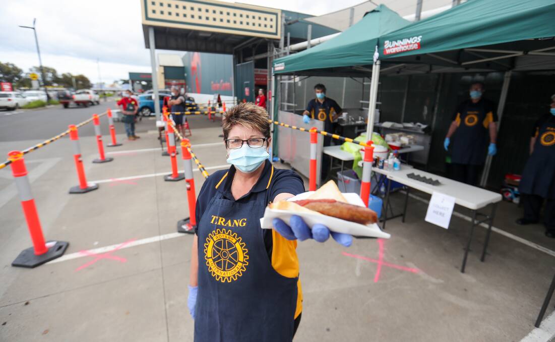 BACK IN BUSINESS: Rotary Club of Terang member Gaye McVilly gets ready to sell sausages at Bunnings. Picture: Morgan Hancock