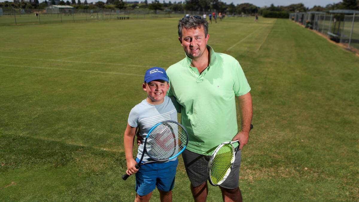 Father-son: Charlie, 9, and Frank Milroy enjoyed the Family Fast4 event on Sunday at Warrnambool Lawn Tennis Club. Picture: Morgan Hancock