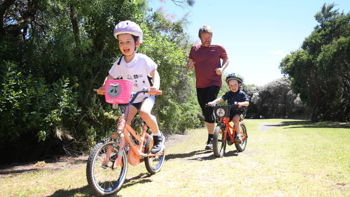 Loads of fun: Warrnambool Tri Club's Peter Gaffy with daughter Lucy, 5, and son James, 3. Picture: Mark Witte