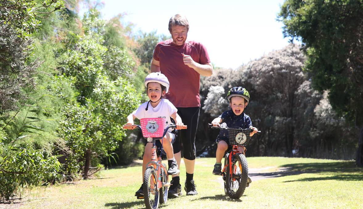 Triathlon time: Warrnambool Tri Club's Peter Gaffy with daughter Lucy, 5, and son James, 3. Picture: Mark Witte