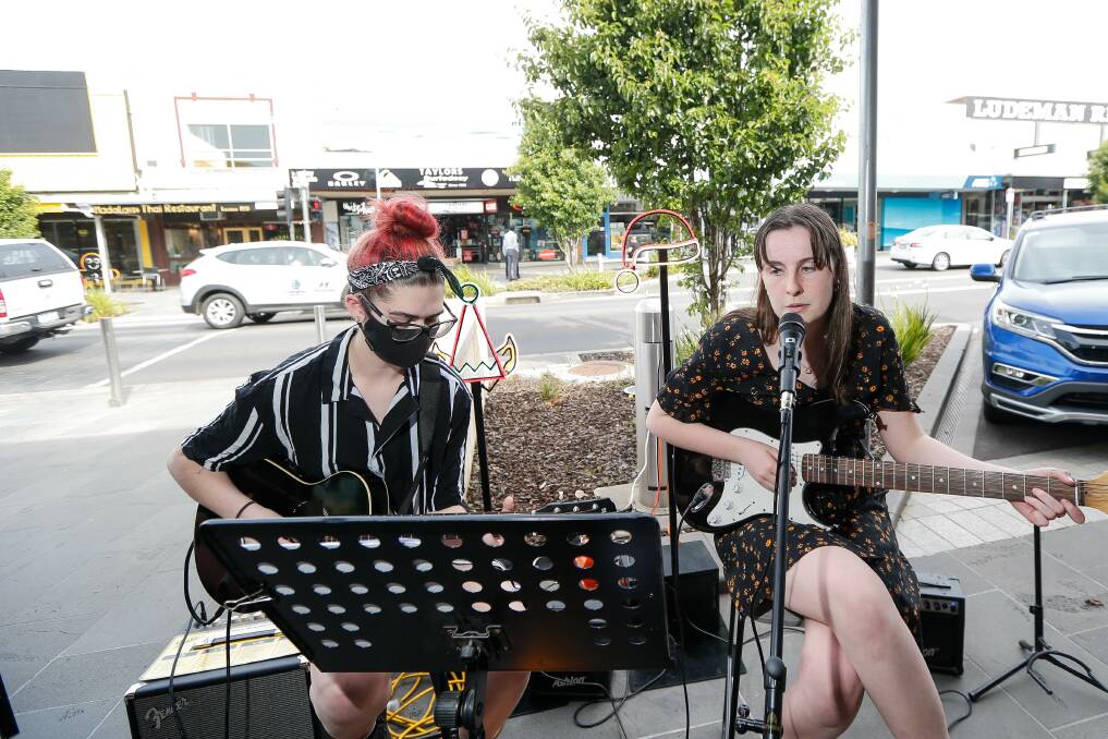 Buskers Melody Speed and Tess O'Connor perform on Liebig Street. Picture: Anthony Brady