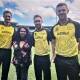 Australian cricket stars Mitchell Starc, left, Glenn Maxwell and Josh Hazlewood model Aunty Fiona Clarke's latest designs which will be worn in the T20 World Cup which starts next month. Picture supplied