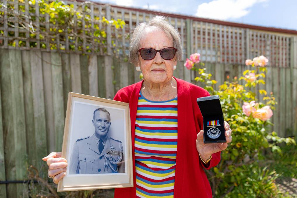 Helen Raw with a picture of her late husband Peter and the 20th medal he received for his role with the RAAF. Picture by Eddie Guerrero