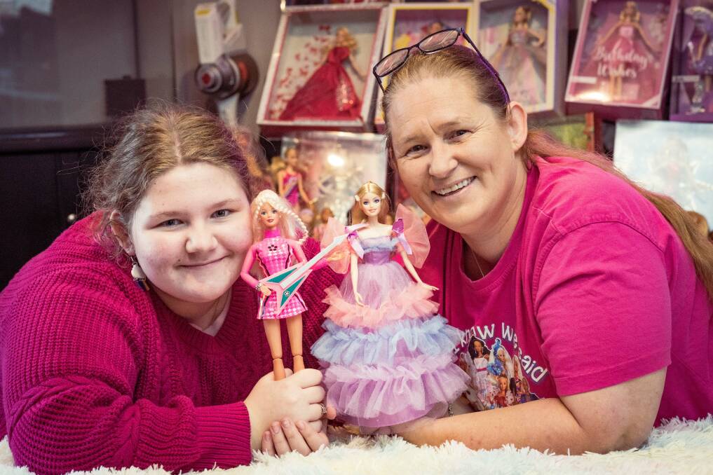Warrnambool's Lillee-May, 11, and Billie-May Reason with some of their favourite Barbies out of their collection of 60. Picture by Sean McKenna