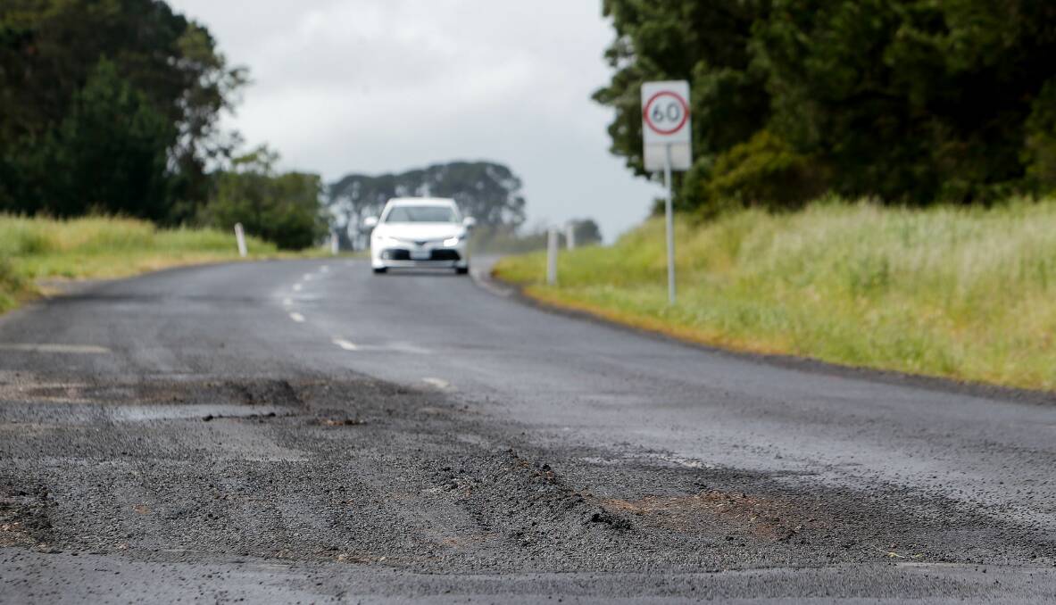 Repaired?: The patch-up that has angered drivers. The section of road carries permanent 60km/h roadwork speed limits. Picture: Anthony Brady
