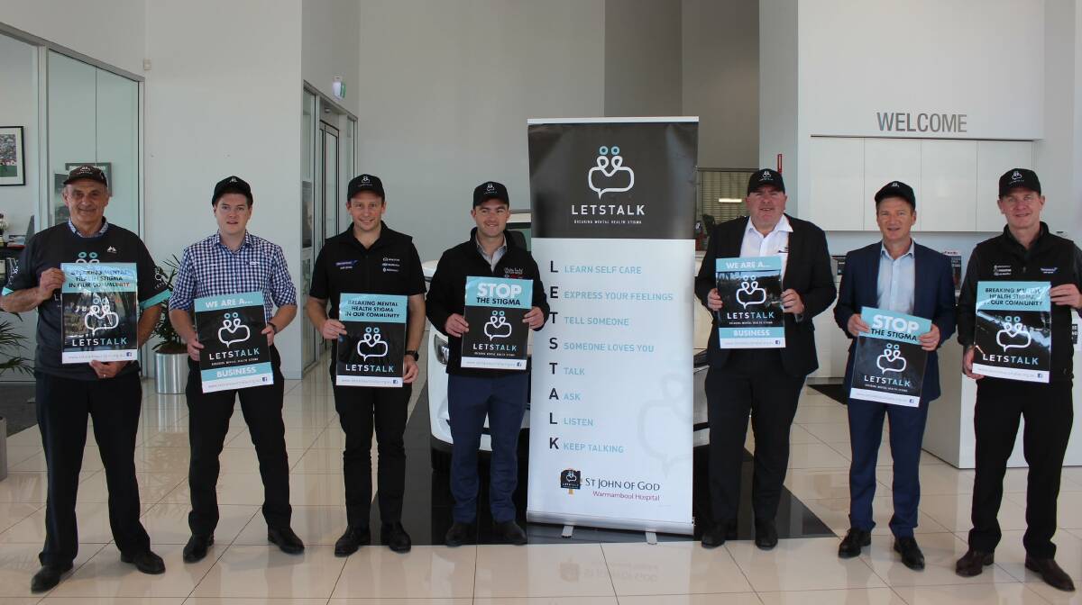 Fully supported: Warrnambool car dealers with Let's Talk co-founder John Parkinson (left). The dealers have back an initiative to place stickers of the sun visors of all new vehicles.
