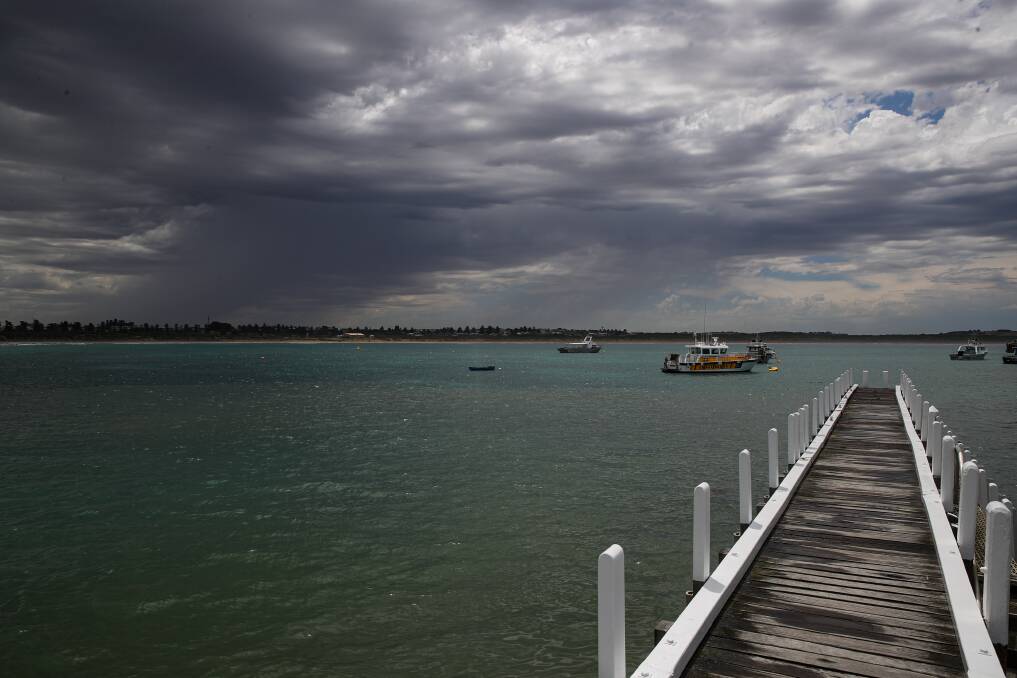 Stormy: The clouds roll in across Warrnambool's Lady Bay on Thursday. Picture: Morgan Hancock