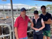 HAPPY: Clive, Donna and Chris Baxter sold 41 joined heifers to a top of $3300 and average of $3100 at Camperdown on Friday.