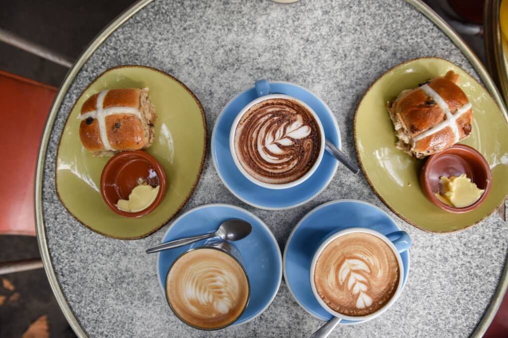 The buns are easy - just buy and bake. But the fancy swirls on the cappuccinos might need a little practise. Picture Shutterstock.