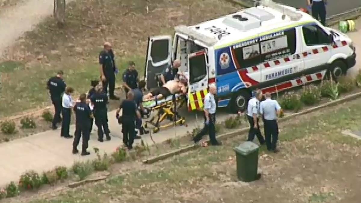 Saved: Drug lord Tony Mokbel being attended to by medical staff after the alleged stabbing at Barwon Prison last year. Sources say Portland ice trafficker Steven Logan stepped in to save him.