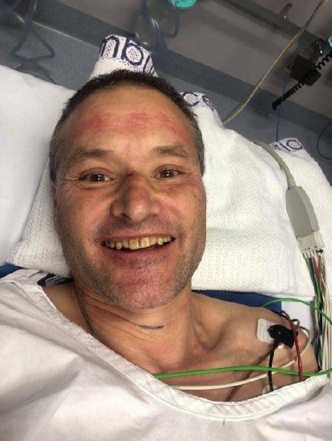 GETTING BETTER: Chris Rantall pictured in hospital after surviving a skydiving accident at Torquay.