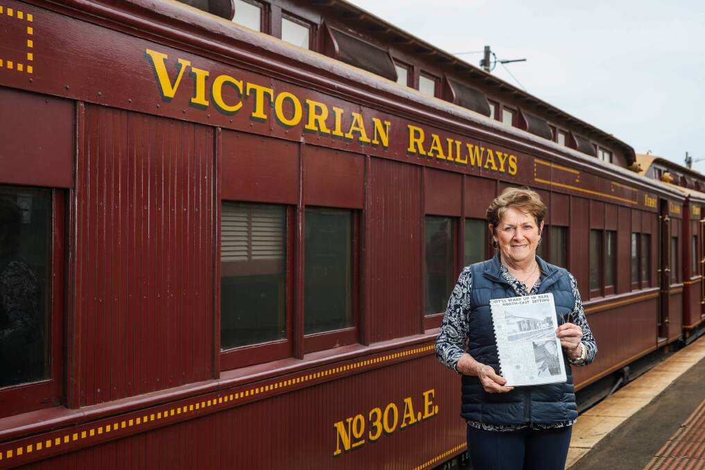 HISTORY: Jan McIntyre with a scrapbook of clippings from the 1954 Royal Train tour when her father was station master near Benalla, where the Queen and Prince Philip slept overnight. She viewed the heritage train at Warrnambool Railway Station on Sunday. Picture: Morgan Hancock
