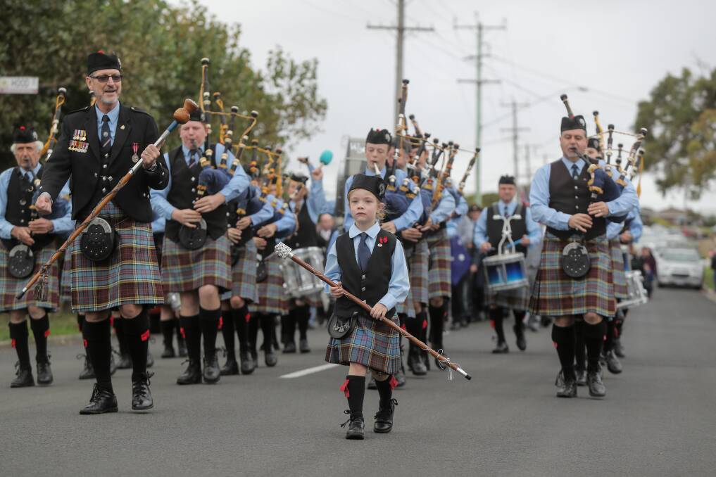 BACK ON: Warrnambool and District Pipes and Drums lead the Dennington ANZAC march in 2017, with junior drum major Myla Young, 6, out front. The march will return to Dennington on Monday after a coronavirus-enforced break.
