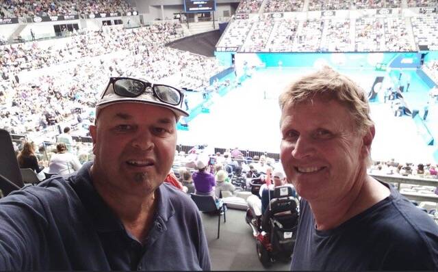 MATES: Martin Porzig and Chris Blackburn are all smiles at the Australian Open tennis. The two taught together at Warrnambool College. Picture: Supplied