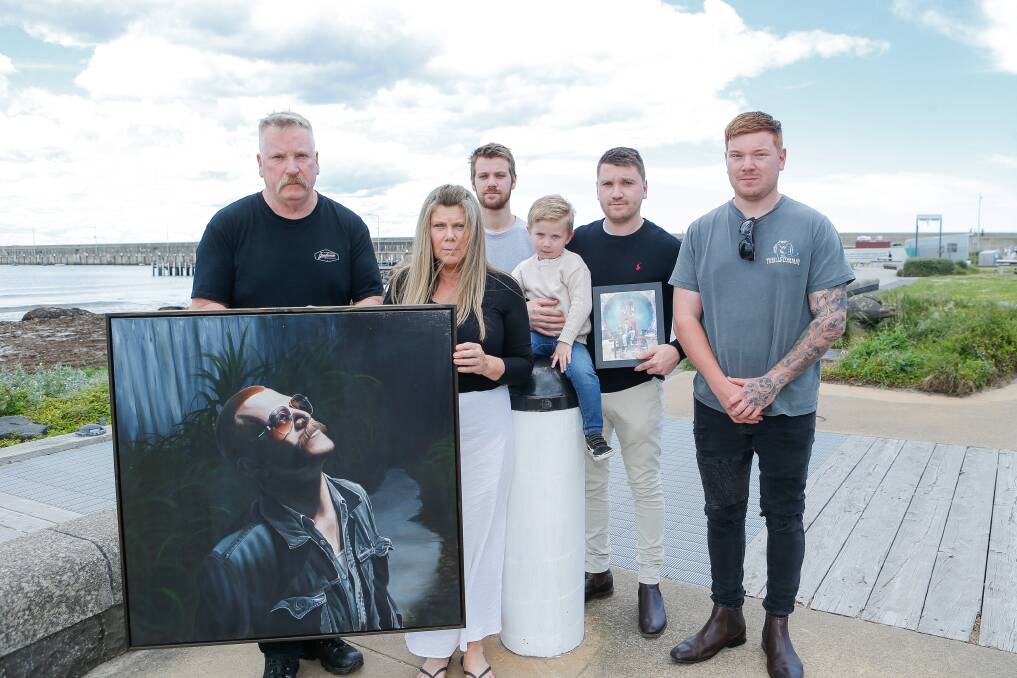 Rob, Kurt, Lee, Jackson, Tate and Spencer Heath, with a painting of Guy Heath who died in October 2019. A music festival is being held in his honour in Feburary. Picture by Anthony Brady.