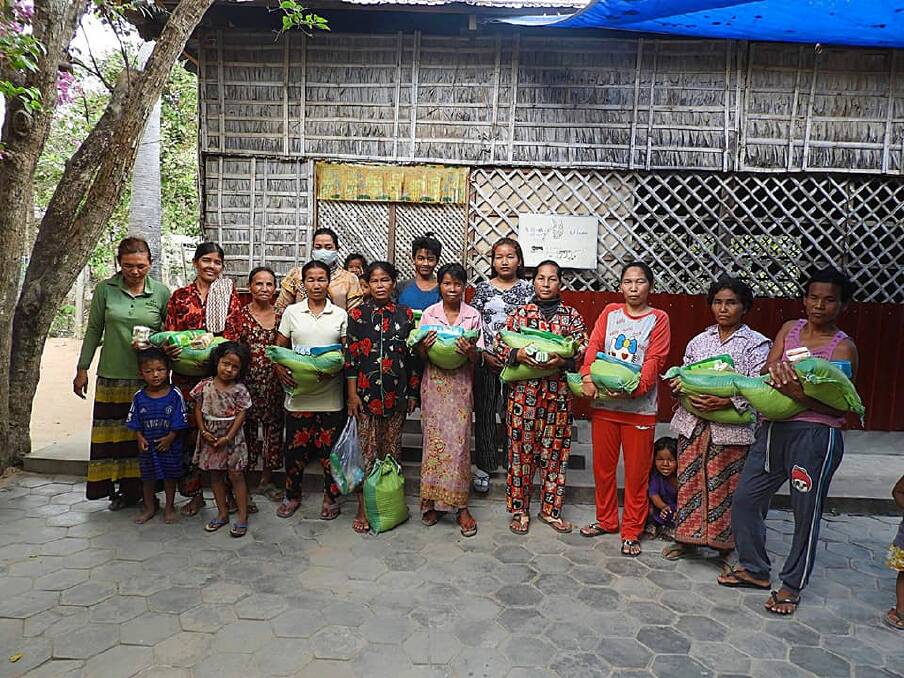 GRATEFUL: Families in Taksenkangbloung village were supplied with 15 kilograms of rice and packets of soap.