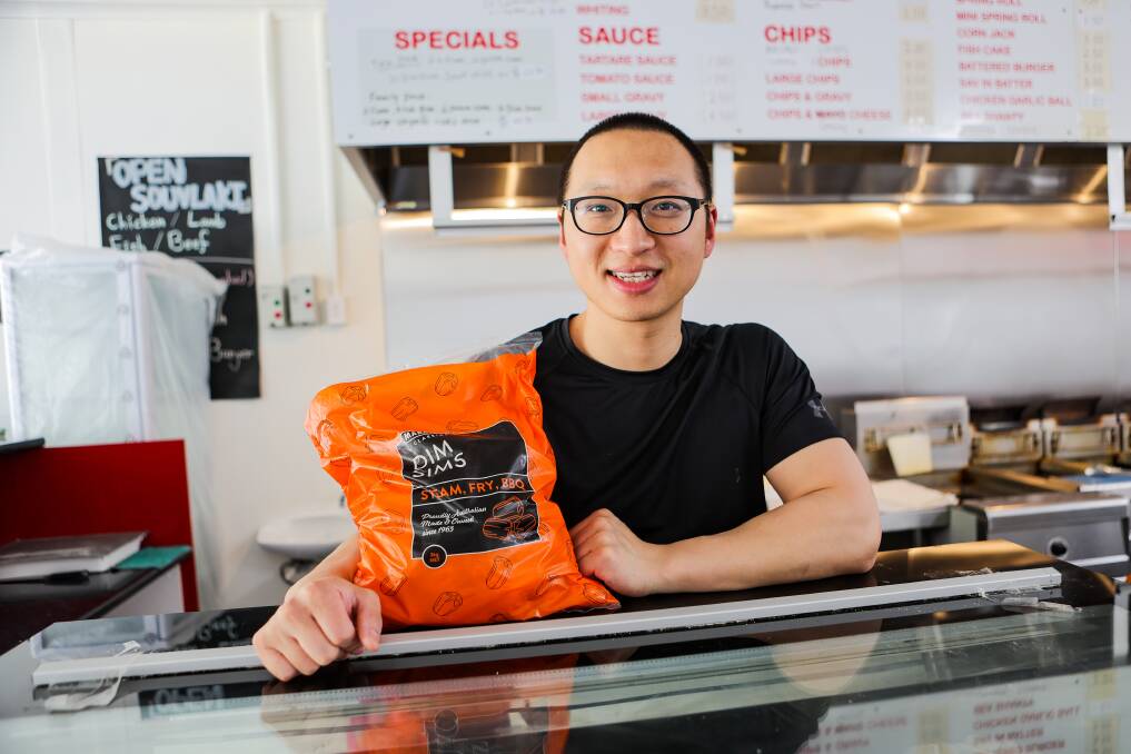 Eric Xiang at Parker's Fish and Chips stockpiled dim sims after word of a flooded factory and a lack of cabbage but the shop remains in high demand. Picture by Anthony Brady.