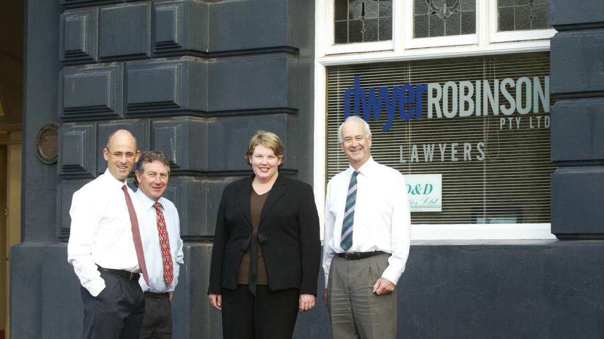 OLD SCHOOL: Tony Robinson with lawyers Peter Lumsden, Caroline Paterson and Jim Dywer outside the former Dwyer Robinson building in 2006. 