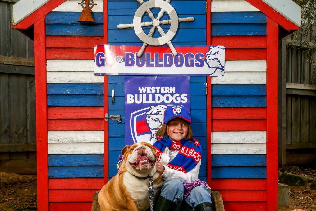 DAUGHTERS OF THE WEST: Indi Neale, 8, and her four-year-old bulldog Marli are supporting the Western Bulldogs at this year's AFL grand final. Picture: Chris Doheny 