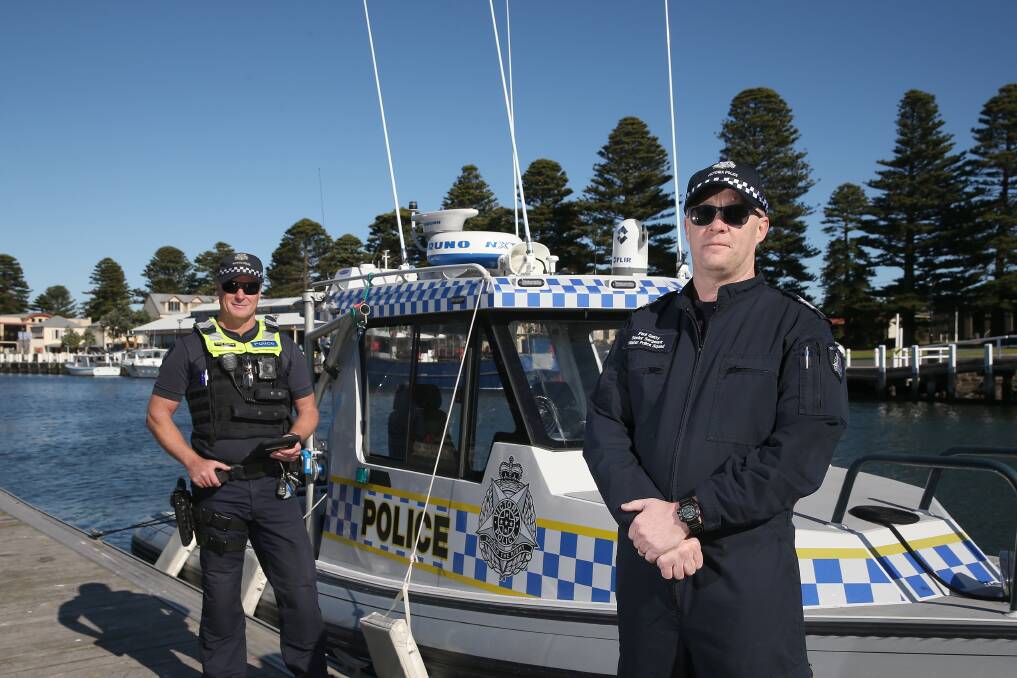  OUT IN FORCE: Water police squad Senior Sergeant Paul Gatty and Port Fairy police Sergeant Dave Walkley patrolling the Port of Port Fairy. Picture: Mark Witte