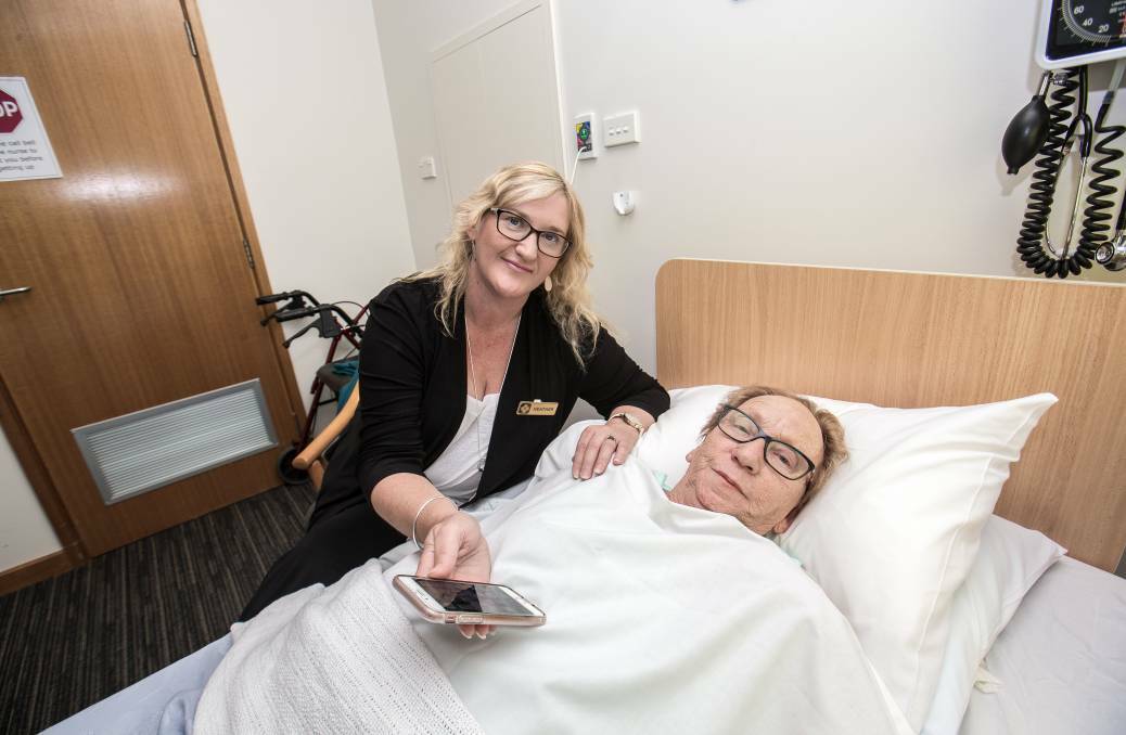 Heather Bullen, with her mum Betty Russell at Timboon Health Services, after she had a fall in 2018 and had no mobile phone reception. Picture: Christine Ansorge