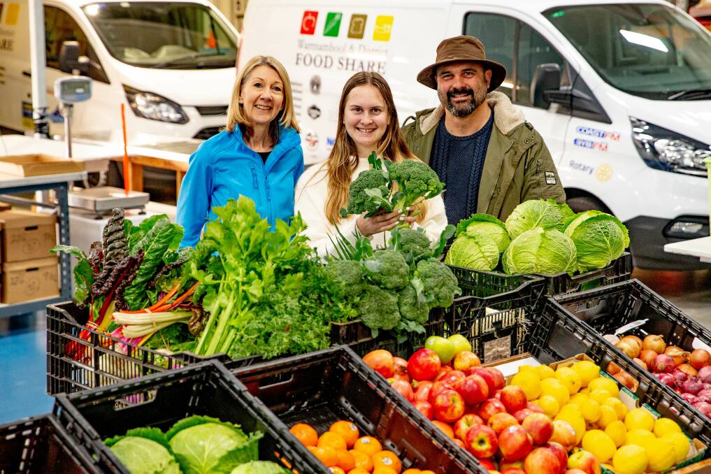 CHARITABLE: Warrnambool and District Food Share chief executive officer Amanda Hennessy with Georgia and Ben Pohlner of Volcano Produce. Picture: Chris Doheny
