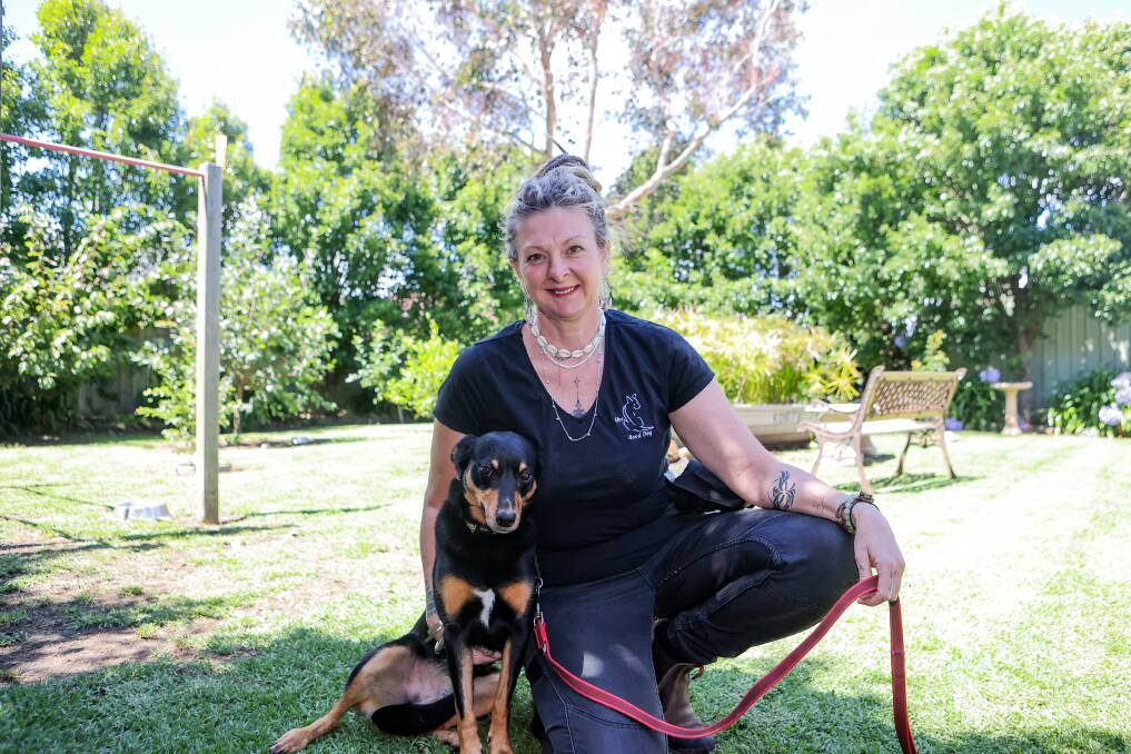 Certified dog trainer Tracey Hilder with her dog Buddy. Pictures by Anthony Brady