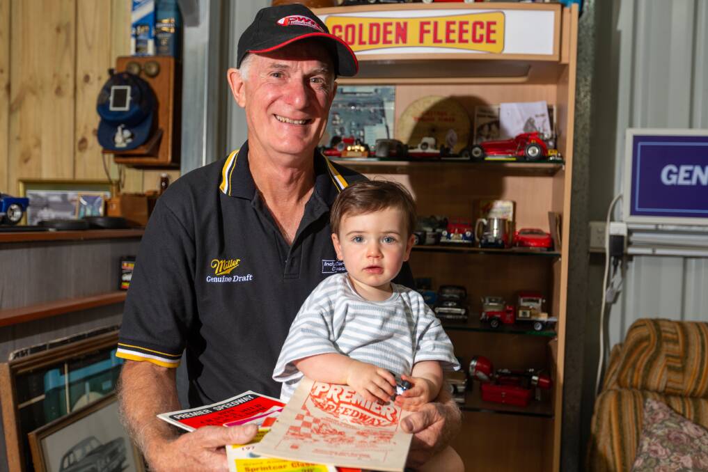 Jeff Vick (former sprintcar driver) and his grandson Max Haberfield with some of the programs he has collected over the years. Picture by Eddie Guerrero.
