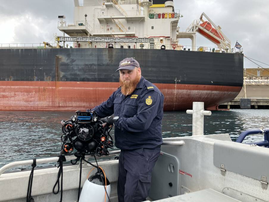 An Australian Border Force maritime operations officer holding a remote operating vehicle (ROV) at Portland over the 2024 Australia Day long weekend. Picture supplied