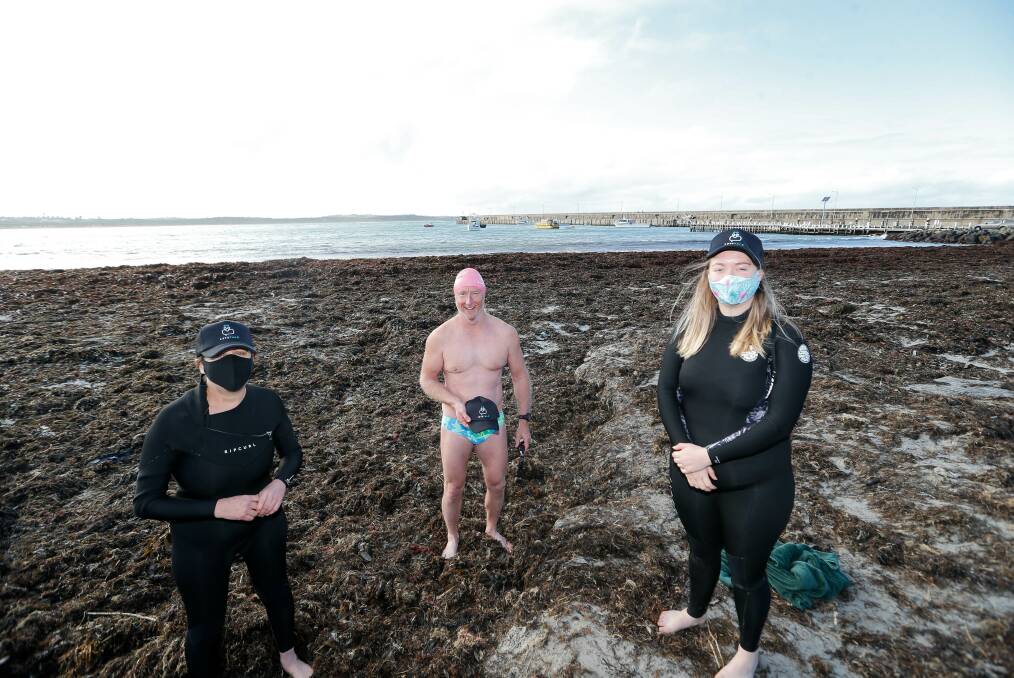 BRAVING THE COLD: Warrnambool's Tamara Mahoney, Koroit's John Sheely and Warrnambool's Bella Mahoney-O'Donnell have clocked up more than 100 consecutive ocean swims during the pandemic. Picture: Anthony Brady