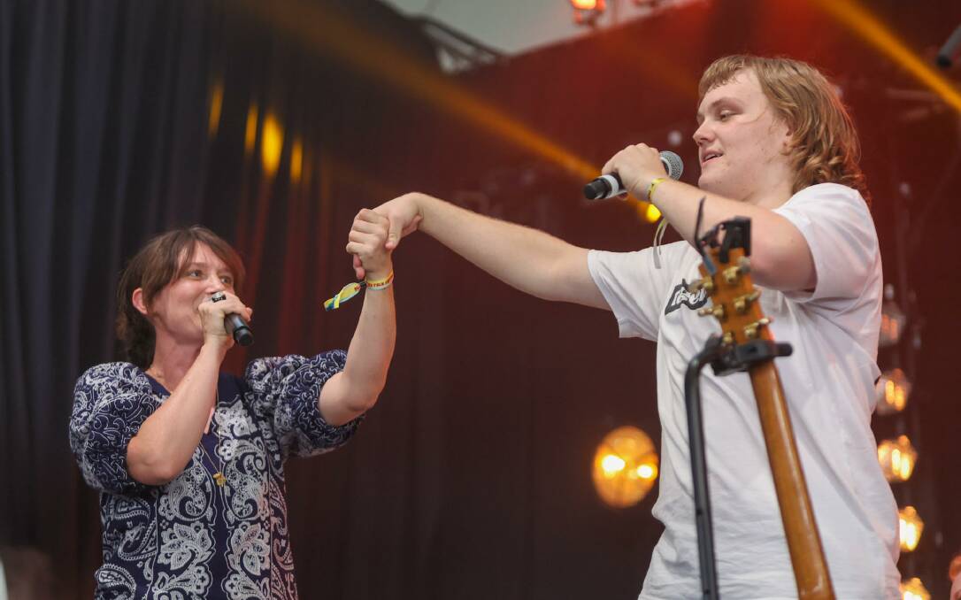 Australian singer-songwriter Sarah Blasko and Find Your Voice Choir member Jacob Paton-Lee were arm-in-arm for Cold Chisel's track Flame Trees. Picture by Eddie Guerrero 