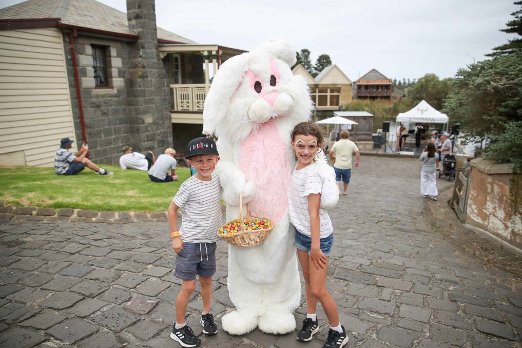 FESTIVE: Mason Walter, 7, and Isla Walter, 8, with the Easter bunny at Flagstaff Hill on Sunday. It was the Geelong siblings' first time at the event, which they attended during a family holiday to Warrnambool. Picture: Morgan Hancock
