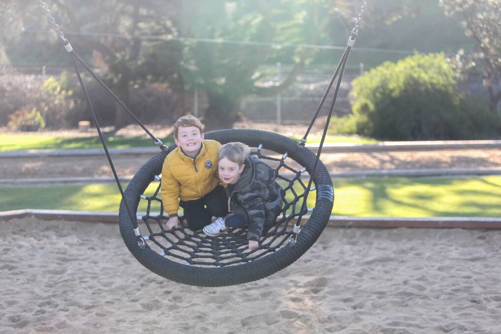 FEELS LIKE SPRING: Warrnambool's Elliot Smock, 5, and brother Austin, 3, enjoying time at the park on a sunny day. Picture: Mark Witte