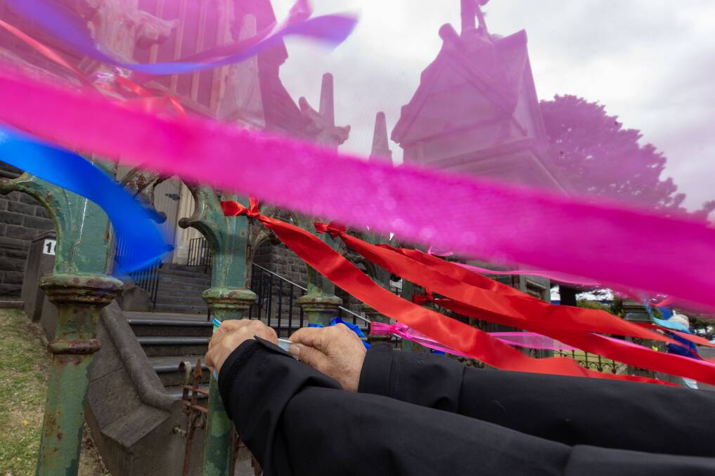 Supporters tie colourful ribbons to the fence of Warrnambool's St Joseph's Church on the day of Cardinal George Pell's funeral. Picture by Eddie Guerrero 