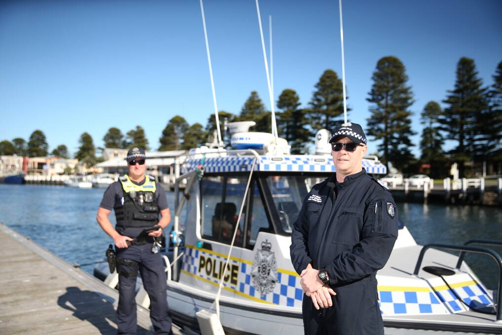 OUT IN FORCE: Water police squad Senior Sergeant Paul Gatty and Port Fairy police Sergeant Dave Walkley patrolling the Port of Port Fairy. Picture: Mark Witte