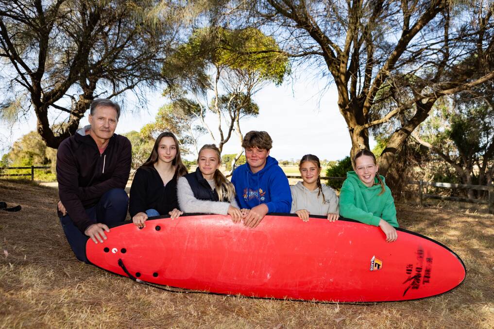 Warrnambool College teacher Stephen Hall with students Foteini Agrafioti Rapti, Iris Beckel, Jerry Dixon, Bonny Albert and Zoe Graham, who saved struggling swimmers at the city's main beach. Picture by Athony Brady