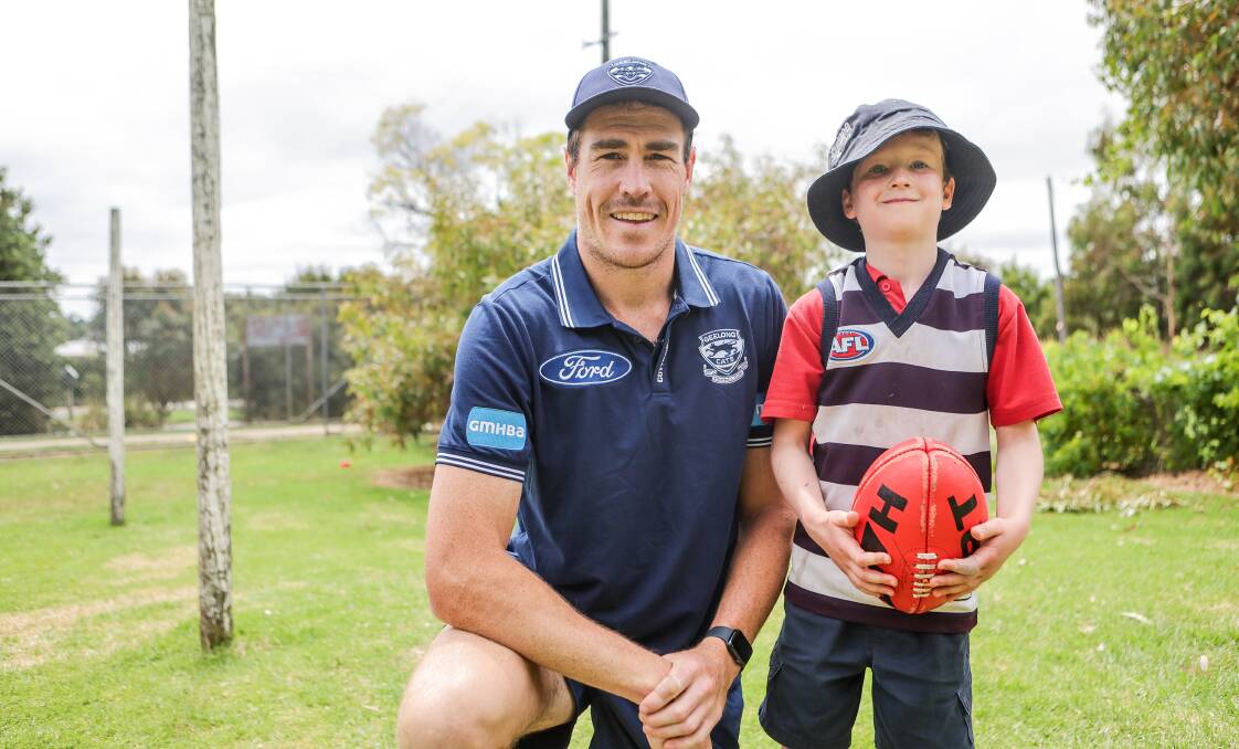 Jeremy Cameron made Geelong fan Harry Walz's day during the Cats' visit to Cudgee Primary School on Monday. Picture by Anthony Brady 