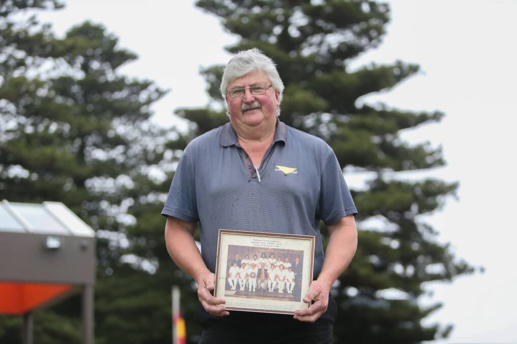 MEMORIES: Former Mailors Flat cricketer John McCosh with the 1979-80 premiership photo. Picture: Mark Witte 