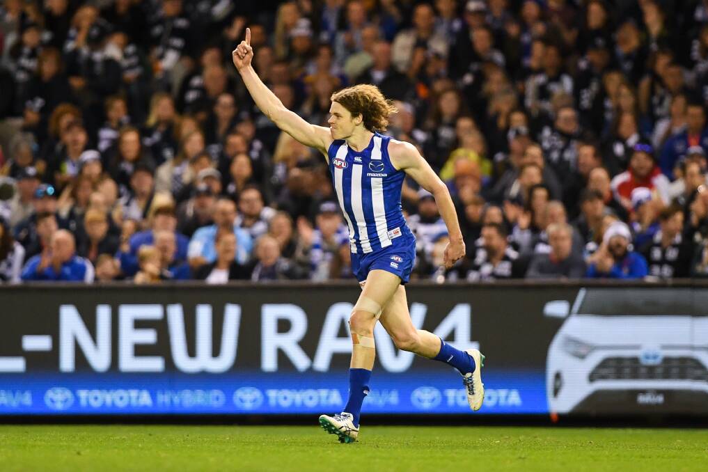 CELEBRATE: North's Ben Brown delights the Marvel Stadium crowd last year. Empty seats could be the norm in 2020. Picture: Morgan Hancock