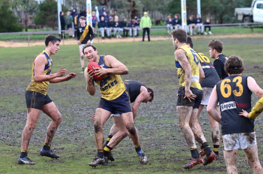 GOT IT: Joe McKinnon reels in a mark for North Warrnambool Eagles in a muddy game at Bushfield. Picture: Justine McCullagh-Beasy 