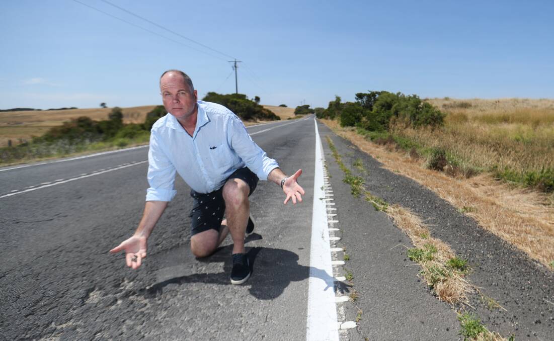 FIX THIS: Bamstone's Michael Steel, pictured on the Princes Highway, is fed up with road conditions in the south-west and says his products are often damaged as a result. Picture: Morgan Hancock 
