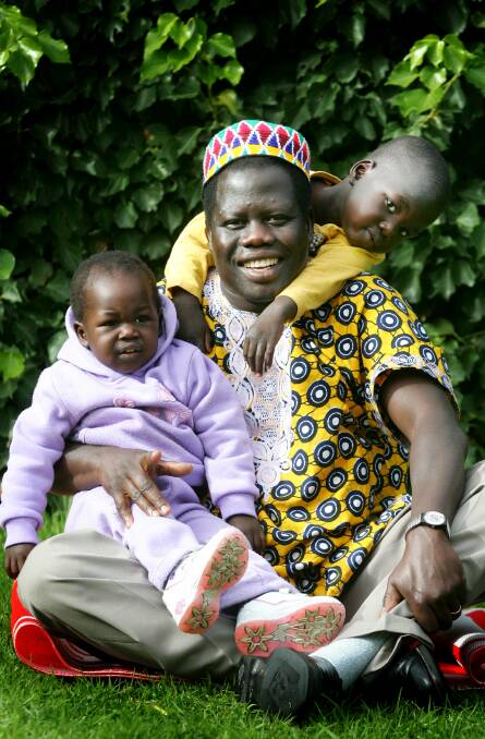  Thomas Lual with children Cigi, 1, and Luamon, 3, in 2008. File picture 