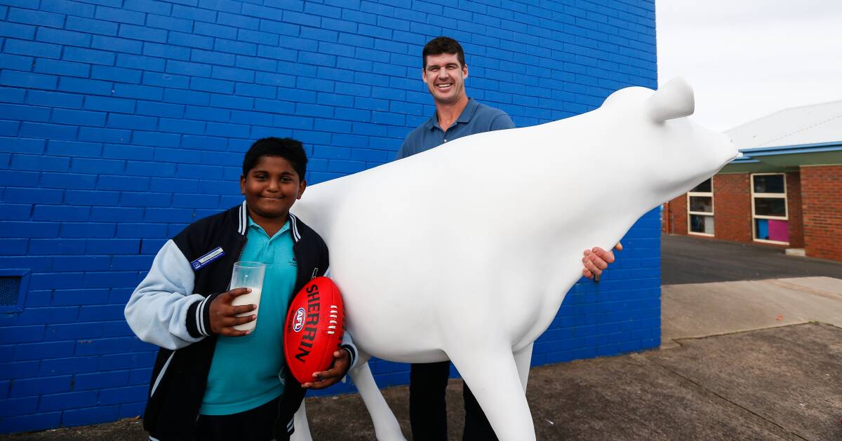 ART ATTACK: Jonathan Brown promoting the Picasso Cows program at Warrnambool West Primary School. He is with student Joshua Dennis-Philip. Picture: Anthony Brady