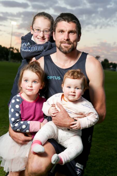 FAMILY FIRST: Ava, 9, Marli, 2, and Holly, nine months, are proud of their dad Brad Bull. Picture: Chris Doheny 