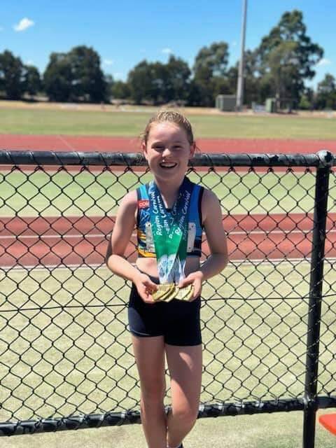 Audrey Bright won five medals at the Western Region little athletics championships. Picture supplied 
