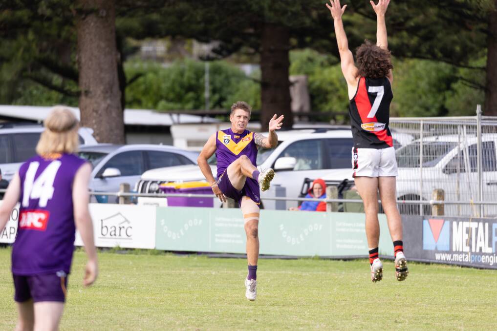 Jason Rowan kicks for goal. The Port Fairy forward slotted two majors in a low-scoring game. Picture by Eddie Guerrero 