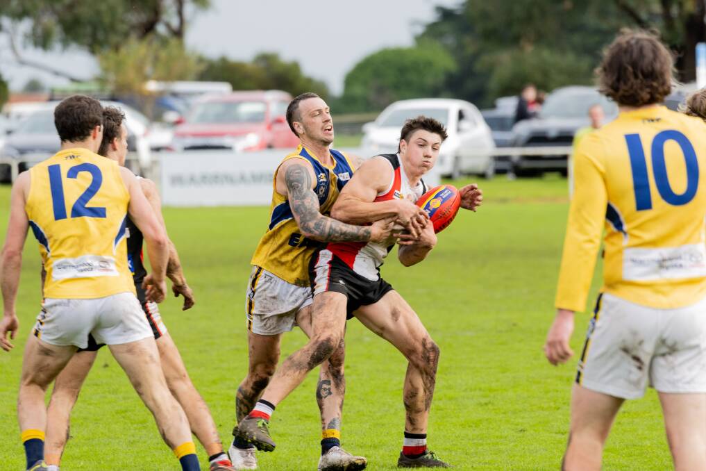 North Warrnambool Eagles' Angus Noske tackles Koroit's Paddy O'Sullivan. Picture by Anthony Brady 
