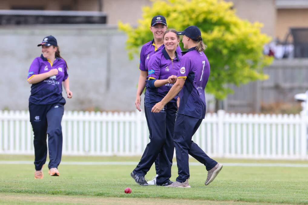Alexis Hunt (second from right) celebrates a wicket for Hawkesdale against Allansford-Panmure. Picture by Eddie Guerrero 