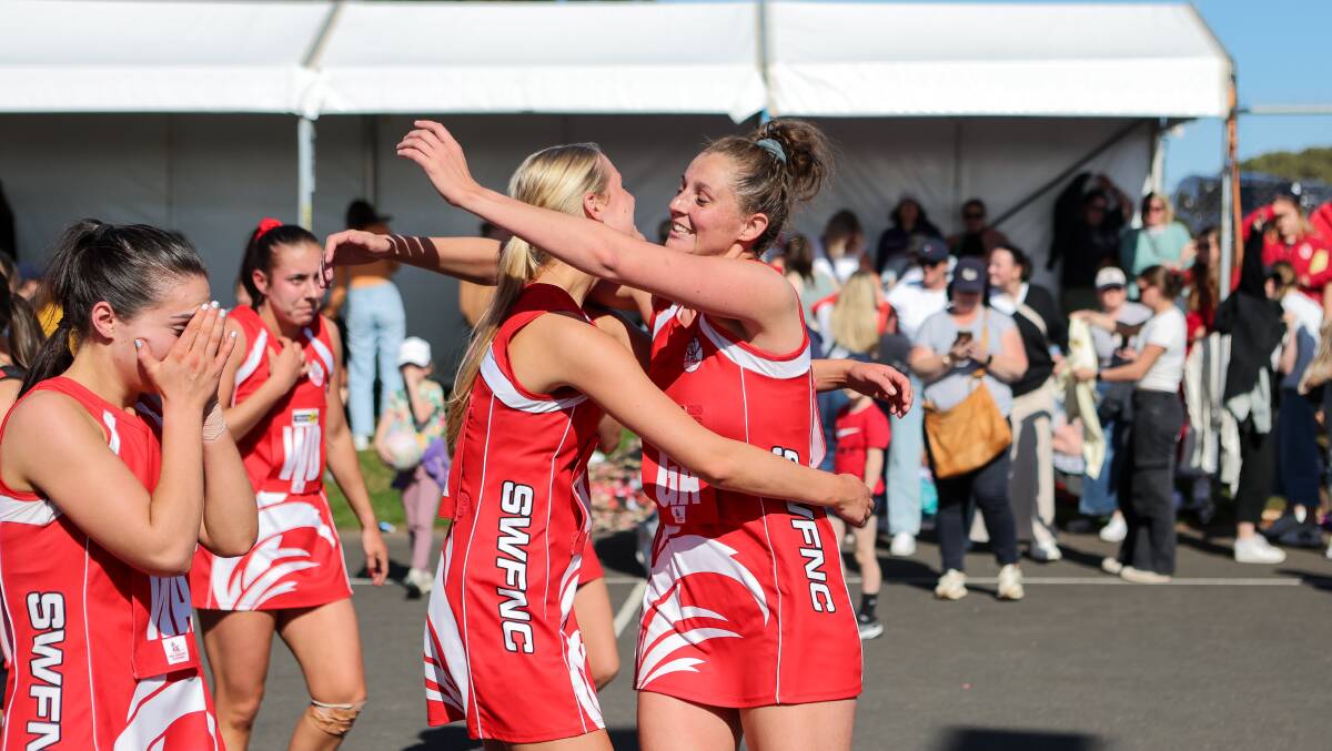 South Warrnambool's Ally Mellblom and Annie Blackburn celebrate the Roosters' grand final win. Picture by Anthony Brady 